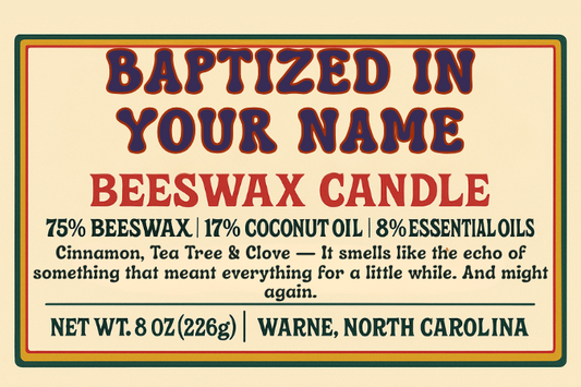 Candle product image featuring the label for “Baptized in Your Name – Cinnamon, Tea Tree & Clove.” Design is vintage-inspired with classic type and minimal layout. Text reads: “natural beeswax, coconut oil, and essential oils / wooden wick.”