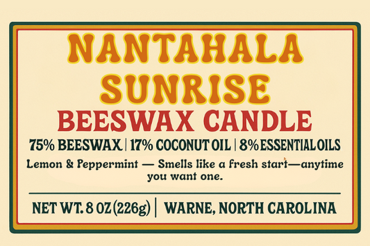 Candle product image featuring a vintage-inspired label with the text “Nantahala Sunrise – Lemon & Peppermint.” Design is clean and minimal, with classic typography and apothecary-style layout. Reads: “natural beeswax, coconut oil, and essential oils / wooden wick.”