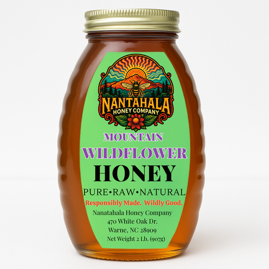 Glass jar of raw Mountain Wildflower honey from Nantahala Honey Company in 2 lb Queenline-style bottle